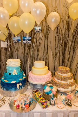 christening decorated table with cakes and sweetsの写真素材