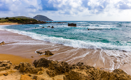 seascape with foamy waves swashing on the beachの写真素材