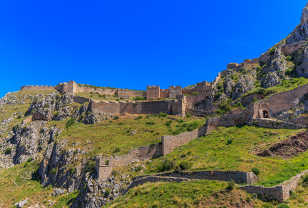 medieval fortress of Acrocorinth up on the hill against clear blue skyの写真素材