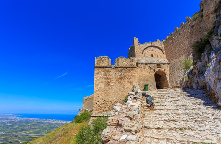 medieval fortress of Acrocorinth up on the hill against clear blue skyの写真素材