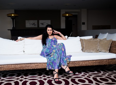 beautiful young brunet woman in blue clothesの写真素材