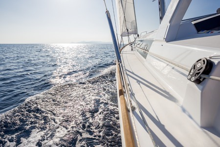sail vessel surfing through the aegean seaの写真素材