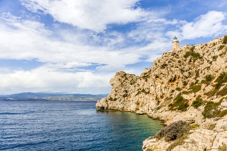distant view on lighthouse in Melagavi near Loutraki, Loutrakiの写真素材