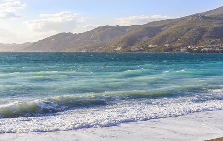 Sea waves at the coastline on a sunny dayの写真素材