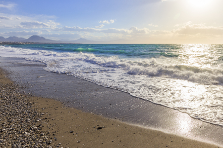 Sea waves at the coastline on a sunny dayの写真素材