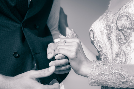 wedding couple holding hands, happy groom and brideの写真素材