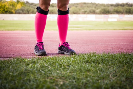 female legs wearing sport equipmentの写真素材
