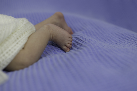 newborn feet in pantsの写真素材