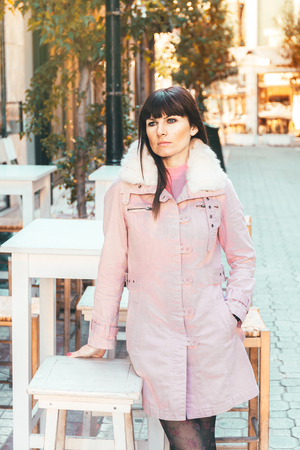 Portrait of a Stylish Pretty Young Woman in Autumn Fashion walking the city, Athens, Greeceの写真素材