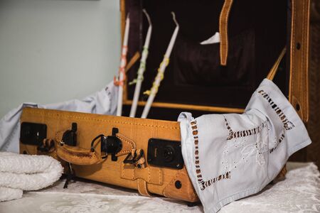 greek Orthodox christening objects - baby clothes, shoes, baptism oil, soap and candlesの写真素材