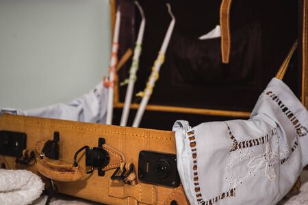 greek Orthodox christening objects - baby clothes, shoes, baptism oil, soap and candlesの写真素材