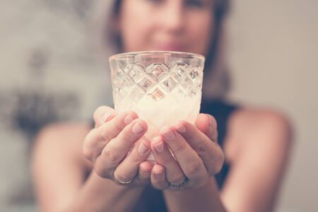 Woman hands holding candleの写真素材