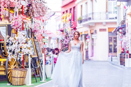 bride in a street with flowersの写真素材