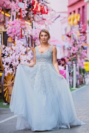 bride in a street with flowersの写真素材