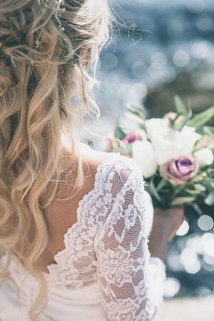 Bride in luxury wedding dress backの写真素材