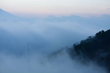Fog approaching volcano slopes Guatemalaの写真素材