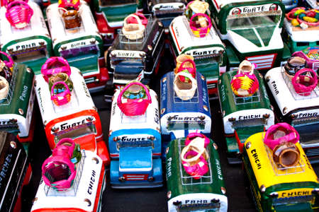 Small souvenir buses with load on a weekend market stall, Chichicastenango, Guatemalaの写真素材