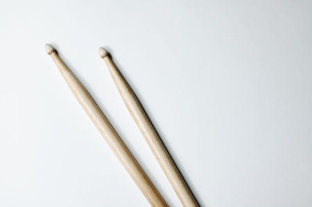Arrangement Highlighting Texture And Focus Of Wooden Drumsticks On Clean Backgroundの写真素材