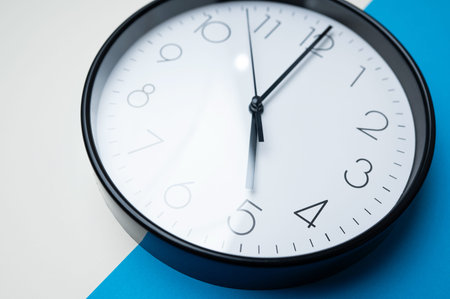 Macro View Of Clock Numbers. Detailed Macro Image Capturing Clock Hands And Glossy Surface