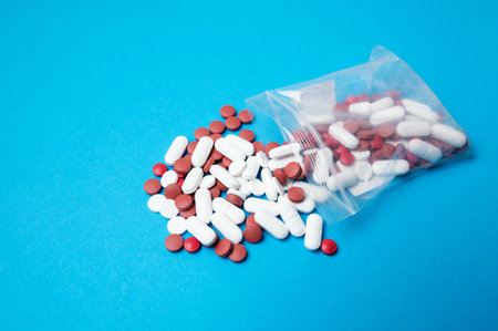 Pharmacy Inventory On Colorful Surface. Medication Packaging And Stock Management Sceneの写真素材