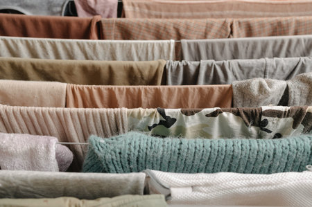 Elegant Display Of Layered Textiles And Accessories For Contemporary Home Staging