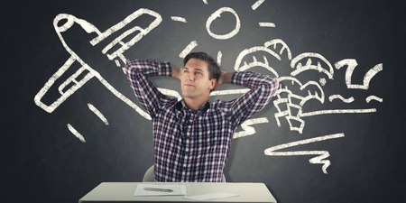 young man in square shirt dreaming about vacation