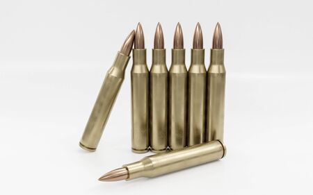 Bullets on white background. A group of rifle bullets isolated on white background. Ammunition on white background. 3d illustration renderの写真素材