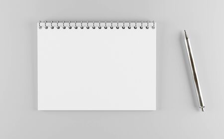 empty horizontal white paper spiral notebook with a metal pen 3d render illustrationの写真素材