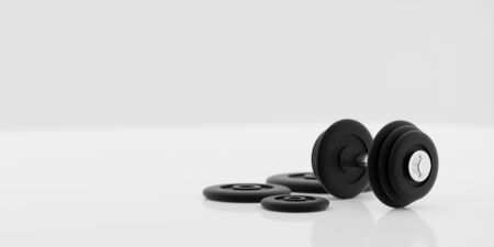 black metal dumbbells and weights on white background 3d illustration renderの写真素材