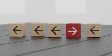 innovation concept critical thinking concept against the mainstream success concept symbolized by wooden bricks on bright office backgroundの写真素材