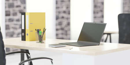 modern office with laptop notebook and files on wooden desk with bright day lighting and big windows...