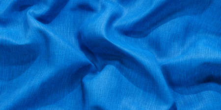 blue folded fabric surface with shadows and highlights 3d render illustrationの写真素材