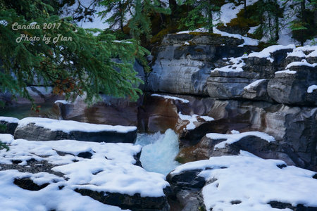 Waterfall in the winter forest. Russia, Siberia, Altai mountains.の写真素材
