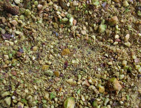 Close-up view of unsalted, green, crushed pistachio nuts.の写真素材