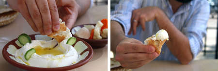 A man dipping pita bread in labneh and offering it.の写真素材
