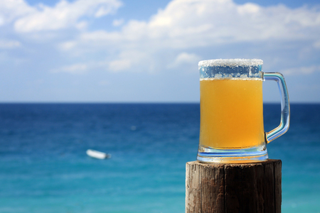 A Mexican beer mug against the blue Mediterranean sea in Batroun, Lebanon.の写真素材