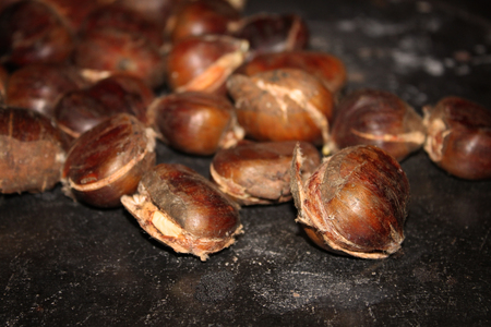 Chestnuts roasting on top of a traditional Lebanese stove called sobia.の写真素材