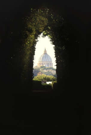 An amazing view of St. Peter's Dome through the Knights of Malta keyhole on the Aventine Hill in Rome.の写真素材