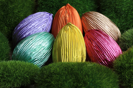 Colorful Easter chocolate eggs  in grass.の写真素材