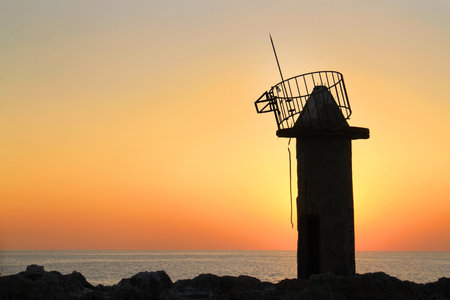 A ruined lighthouse in the coastal town of Batroun, Lebanon.の写真素材