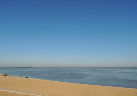 wide river with people at a distanceの写真素材