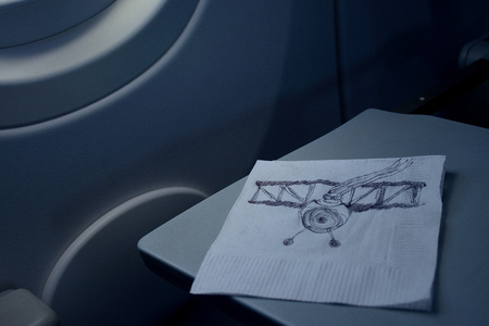 flight concept, airman funny sketched on a paper napkin on the plane tableのeditorial素材