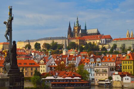 Views of Prague Castle from Charles' Bridge with red roof housesの写真素材