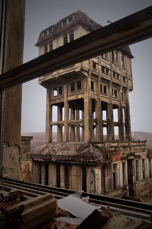 from the window of an old abandoned mine elevatorの写真素材