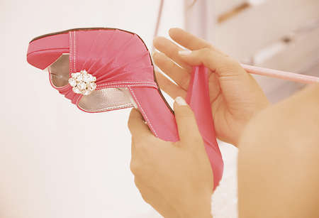 Wedding-Bride writes name of friends under her shoesの写真素材