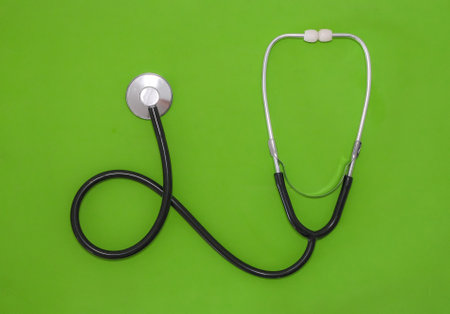 Stethoscope on green background. Medical stethoscope on green background.の写真素材