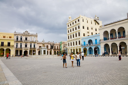 Havana, Cuba, November 28, 2012 - The Plaza Vieja of Havana on a cloudy day with people walking, Cubaのeditorial素材