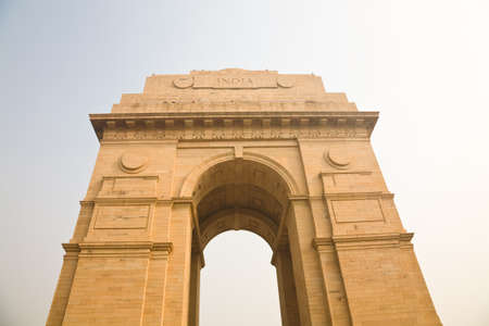 The India Gate, a war memorial on the Rajpath of New Delhi, on a foggy day