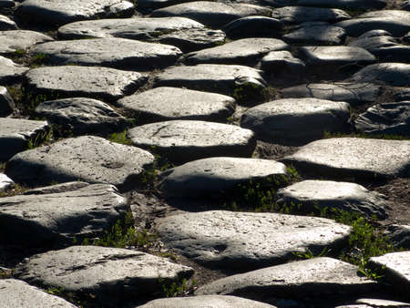 A detail of an ancient Roman road in Rome, Italyの写真素材