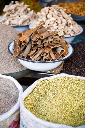A number of Indian spices such as cinnamon, coriander, cumin and pepperの写真素材